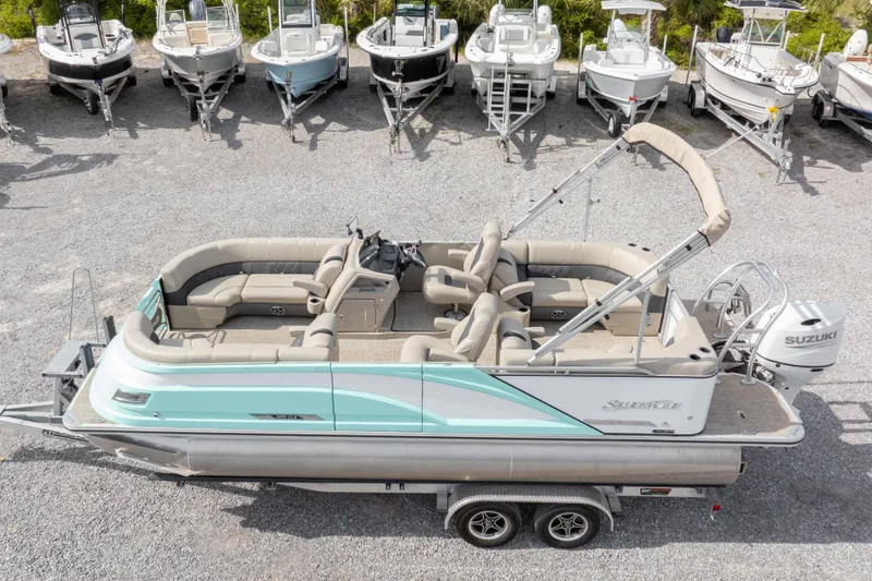 Slide: The Image of 2024 SilverWave 2210 CLS SW5 pontoon boat with Suzuki outboard motor on trailer. - 35