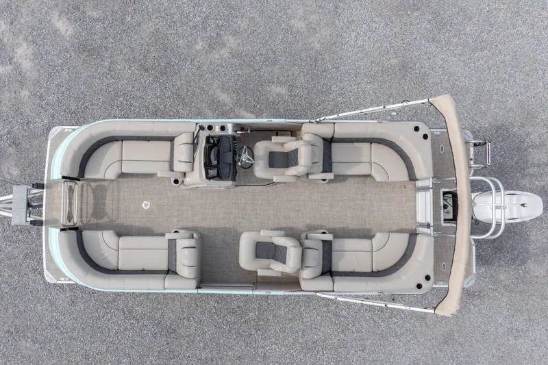 Slide: The Image of 2024 SilverWave 2210 CLS SW5 pontoon boat with beige seating and canopy, parked on gravel. - 38