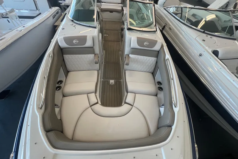 Slide: The Image of 2024 Crownline Eclipse E280 XS boat interior with luxurious seating and sleek design. - 12