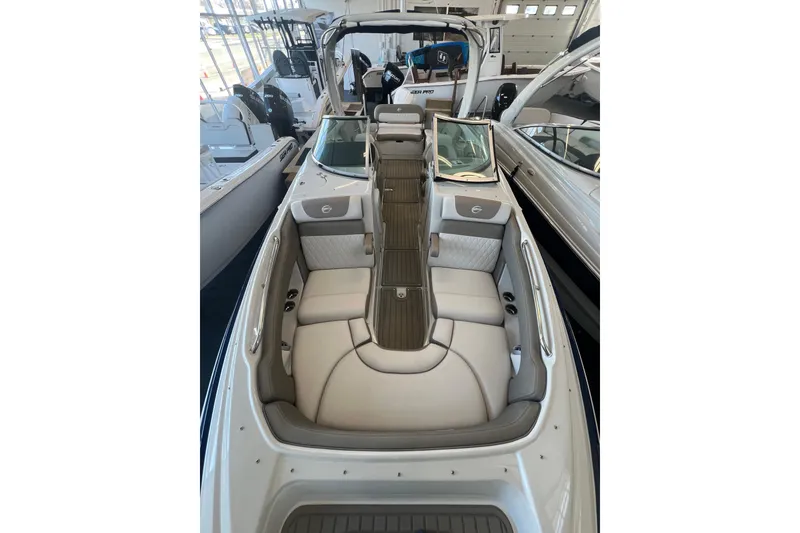 Slide: The Image of 2024 Crownline Eclipse E280 XS boat interior with luxurious seating and modern design. - 13