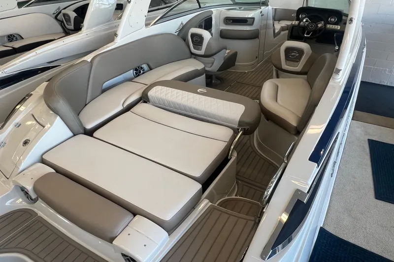Slide: The Image of 2024 Crownline Eclipse E280 XS boat interior with luxurious seating and modern design. - 18