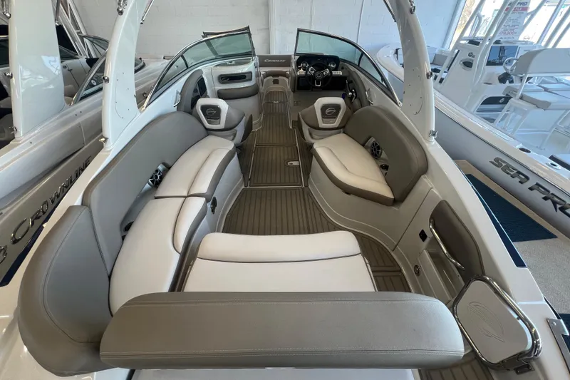 Slide: The Image of 2024 Crownline Eclipse E280 XS boat interior with luxurious seating and modern design. - 2