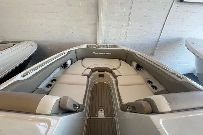 Slide: The Image of 2024 Crownline Eclipse E280 XS boat interior with plush seating and modern design. - 3