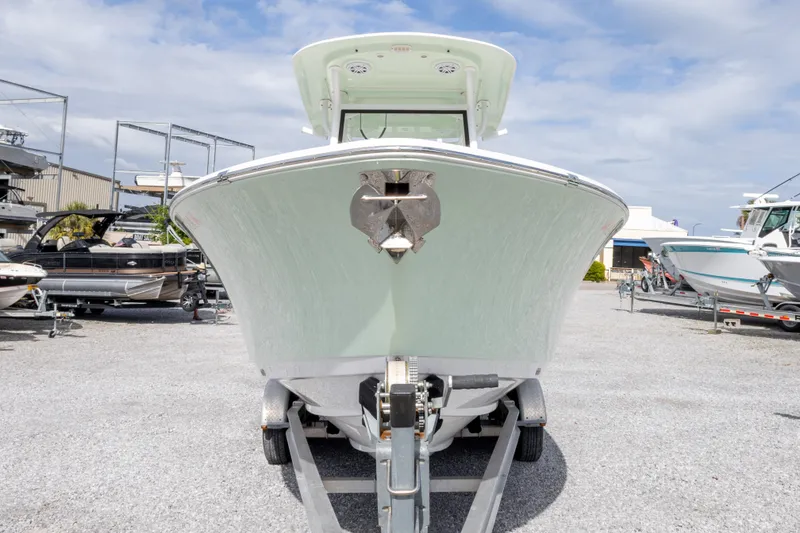 Slide: The Image of 2019 Sportsman Heritage 251 Center Console boat on trailer in marina. - 10