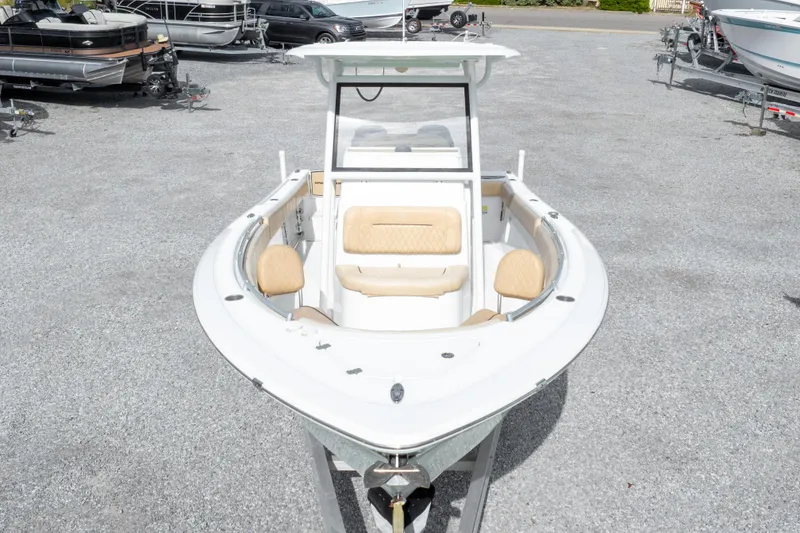 Slide: The Image of 2019 Sportsman Heritage 251 Center Console boat on display in a gravel lot. - 18