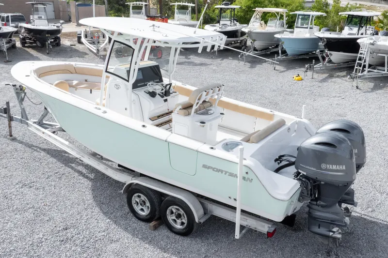 Slide: The Image of 2019 Sportsman Heritage 251 Center Console boat on trailer with Yamaha engines. - 2