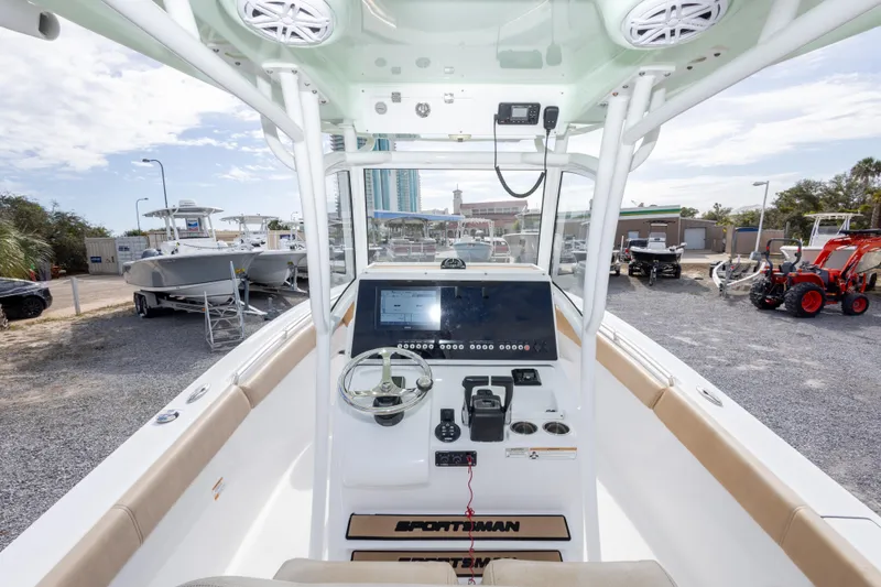 Slide: The Image of 2019 Sportsman Heritage 251 Center Console boat interior with modern dashboard and steering wheel. - 22