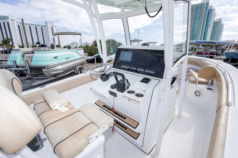 Slide: The Image of 2019 Sportsman Heritage 251 Center Console boat interior with modern dashboard and seating. - 28