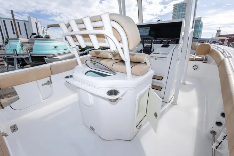 Slide: The Image of 2019 Sportsman Heritage 251 Center Console boat interior with seating and control panel. - 41