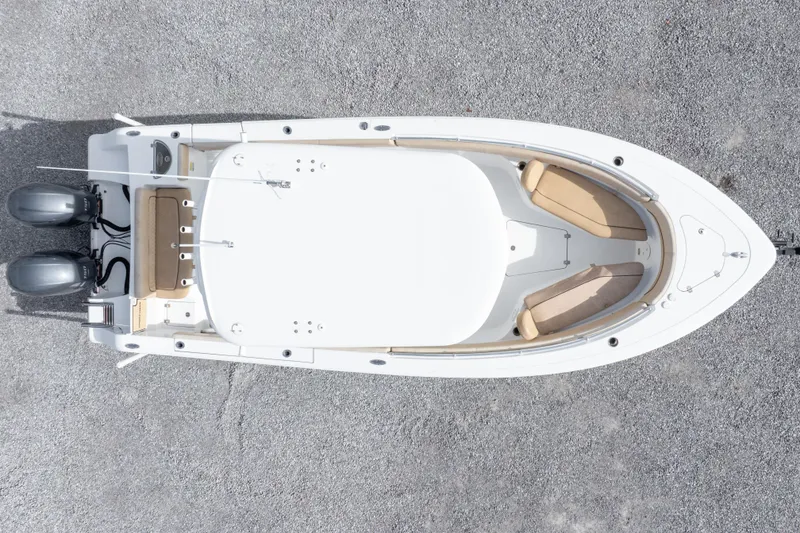 Slide: The Image of Overhead view of 2019 Sportsman Heritage 251 Center Console boat on gravel surface. - 7