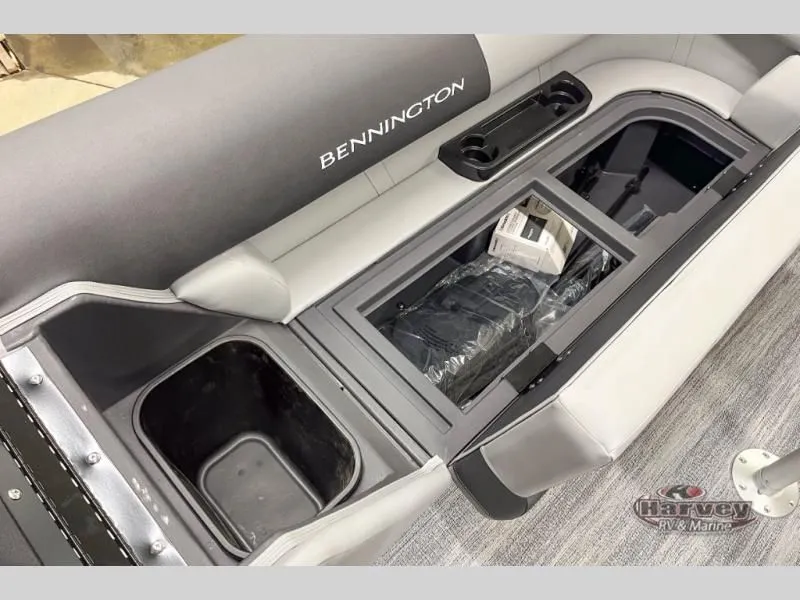 Slide: The Image of Interior of Bennington S Series SSRSF 2026 with storage and cup holders. - 20
