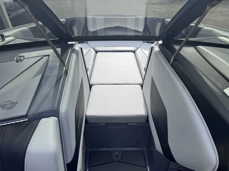 Slide: The Image of Interior of 2024 Malibu Wakesetter 23 MXZ with gray upholstery. - 11
