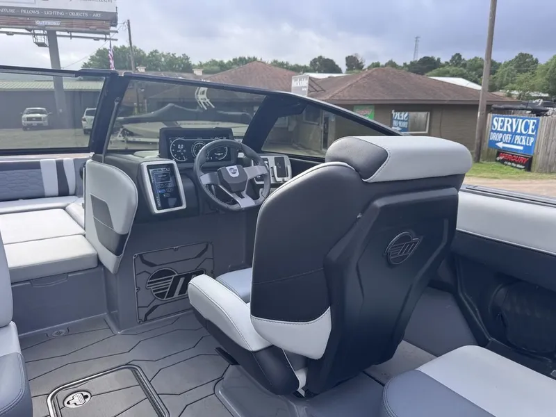 Slide: The Image of Interior of 2024 Malibu Wakesetter 23 MXZ featuring modern cockpit. - 13