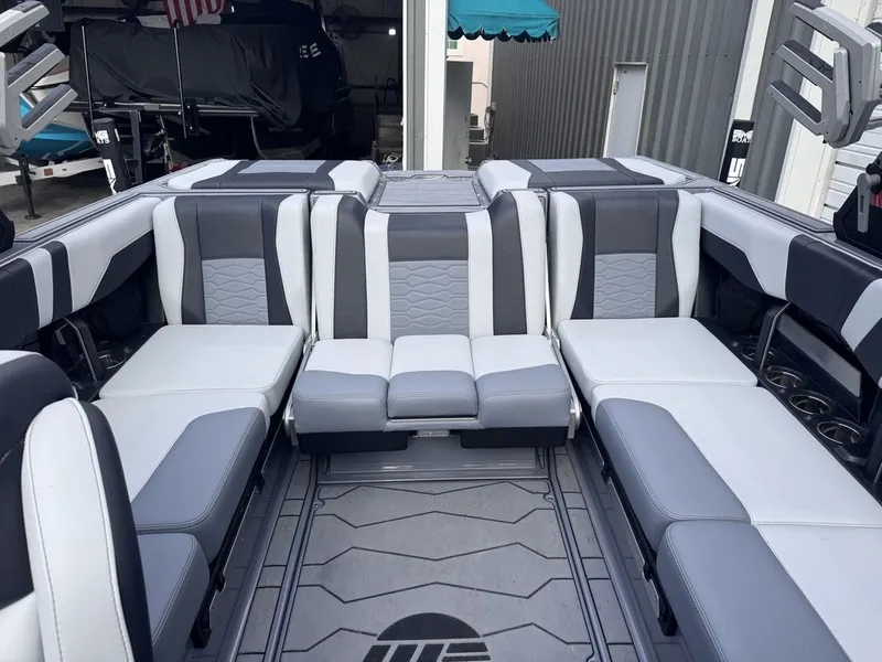 Slide: The Image of 2024 Malibu Wakesetter 23 MXZ interior with gray and white seating. - 15