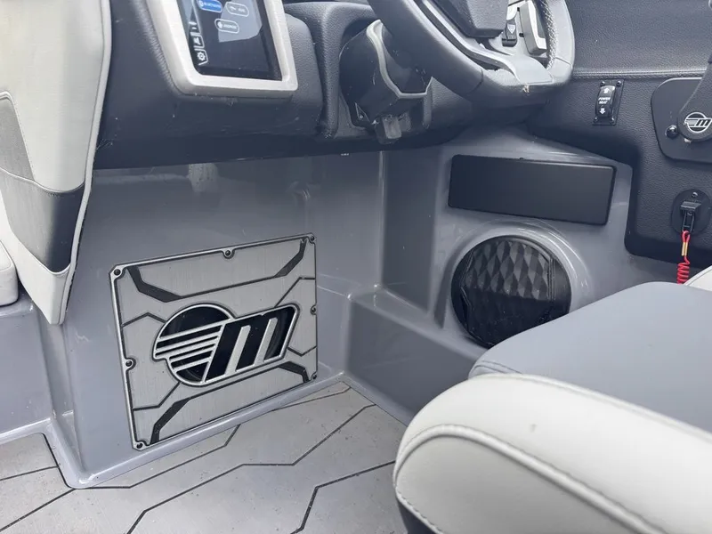 Slide: The Image of Interior of 2024 Malibu Wakesetter 23 MXZ with control console. - 21