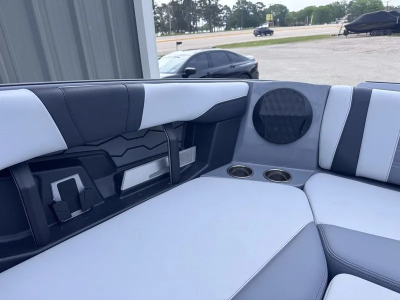Slide: The Image of Interior of 2024 Malibu Wakesetter 23 MXZ with speaker and cup holders. - 22