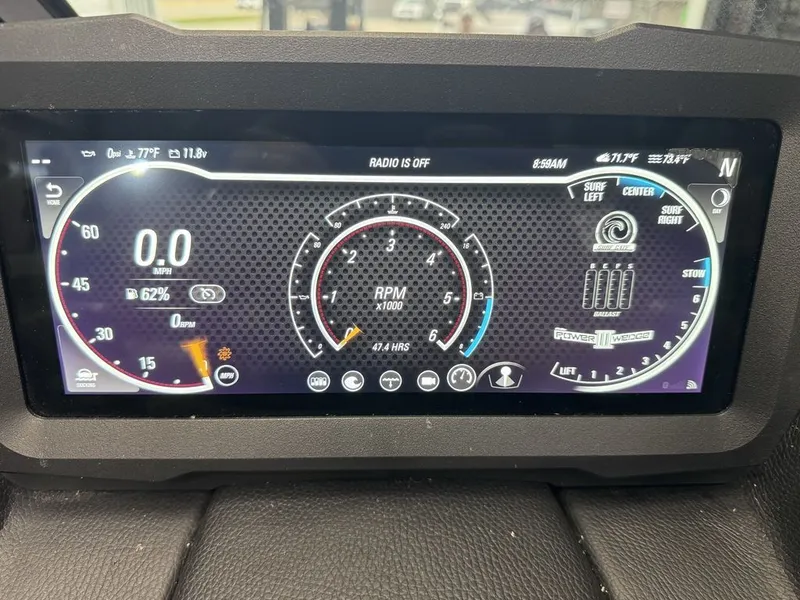 Slide: The Image of 2024 Malibu Wakesetter 23 MXZ dashboard with digital displays. - 25