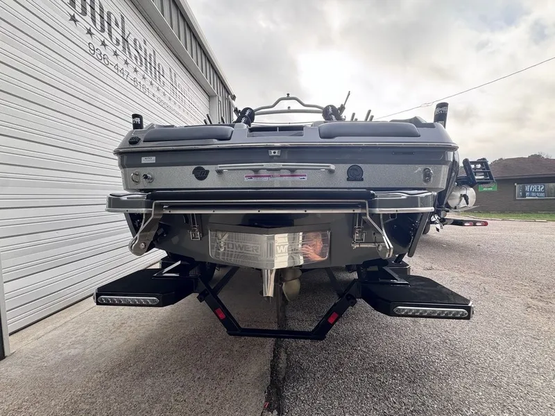 Slide: The Image of Rear view of the 2024 Malibu Wakesetter 23 MXZ boat. - 6