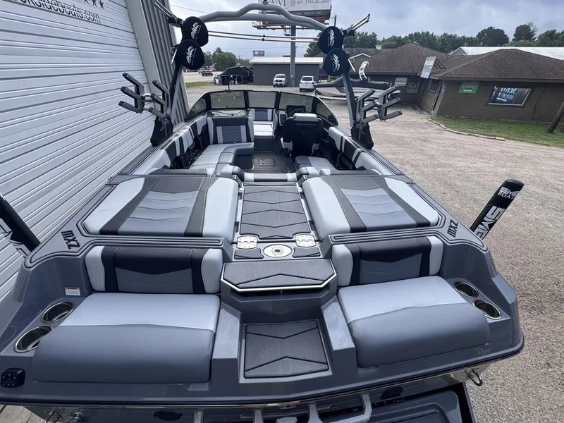 Slide: The Image of 2024 Malibu Wakesetter 23 MXZ boat interior, gray upholstery, modern features. - 8