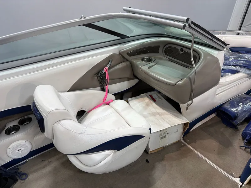 Slide: The Image of Interior of a 2011 Crownline 21 SS boat with white seating. - 11