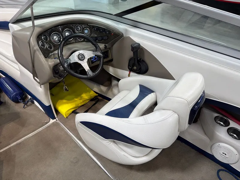 Slide: The Image of Interior of a 2011 Crownline 21 SS boat with steering console. - 12