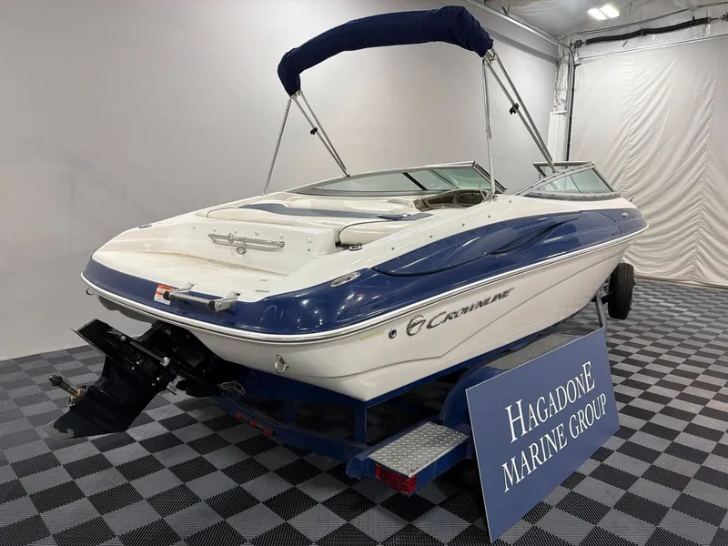 Slide: The Image of 2011 Crownline 21 SS boat in showroom. - 3