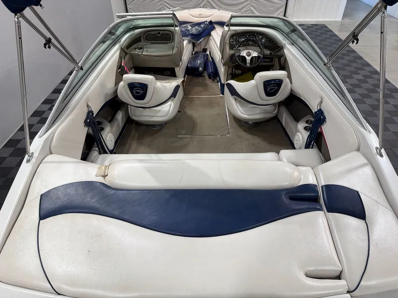 Slide: The Image of Interior of a 2011 Crownline 21 SS boat with blue and white seating. - 6