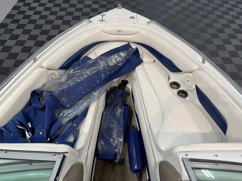 Slide: The Image of Interior of a 2011 Crownline 21 SS boat with blue covers. - 8