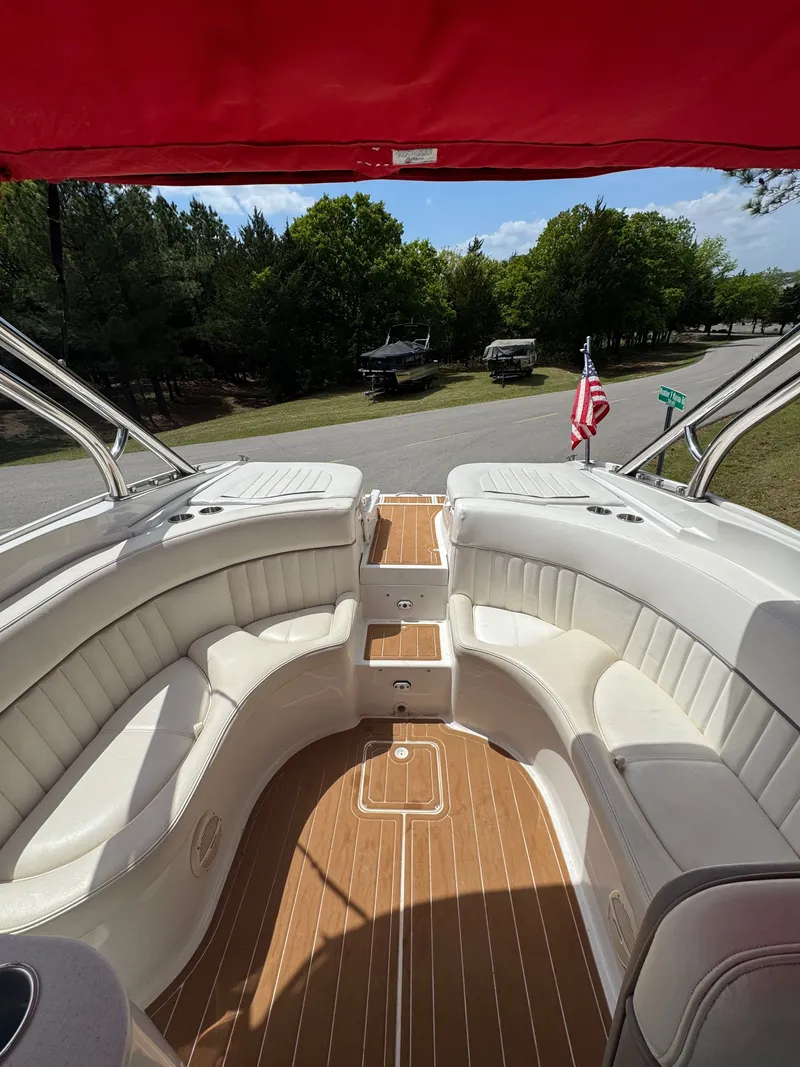 Slide: The Image of Interior view of a 2003 Cobalt 282 boat with red canopy. - 10