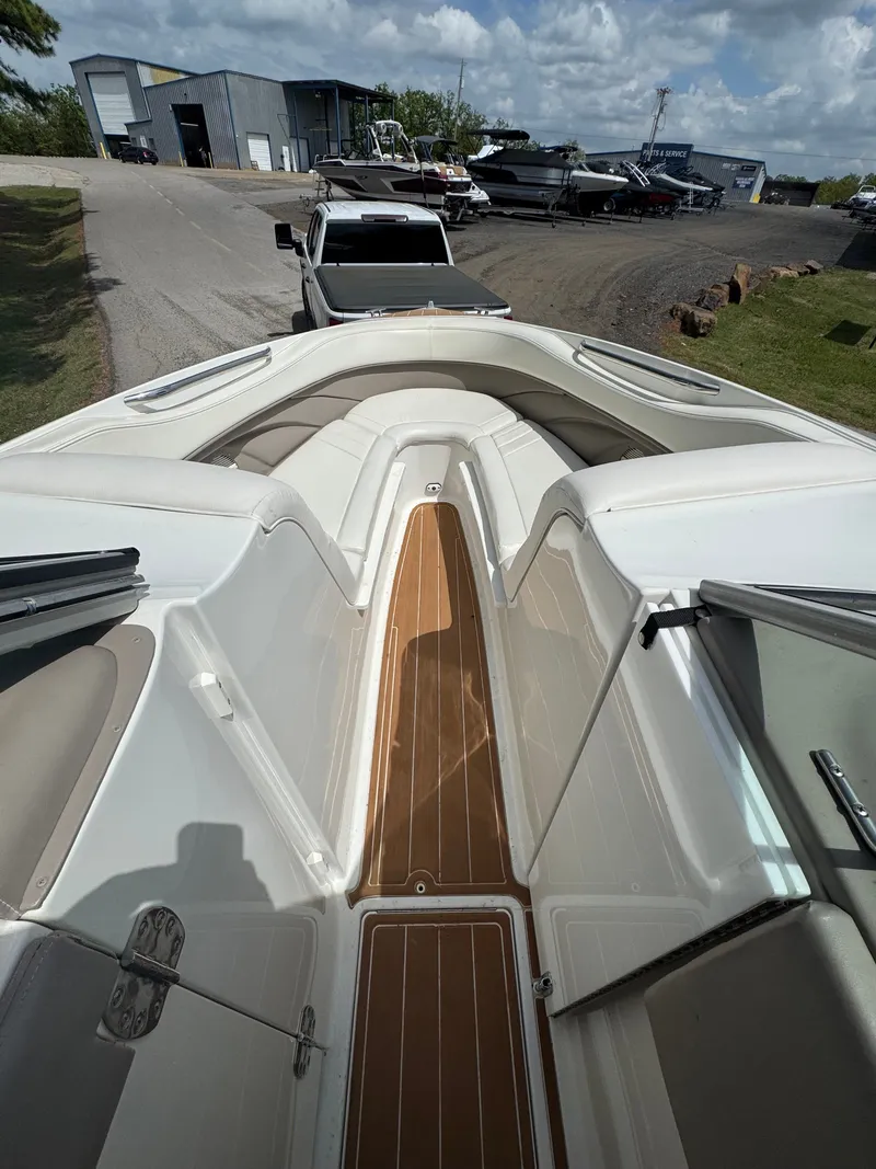 Slide: The Image of 2003 Cobalt 282 boat with wood deck and cushioned seating. - 11