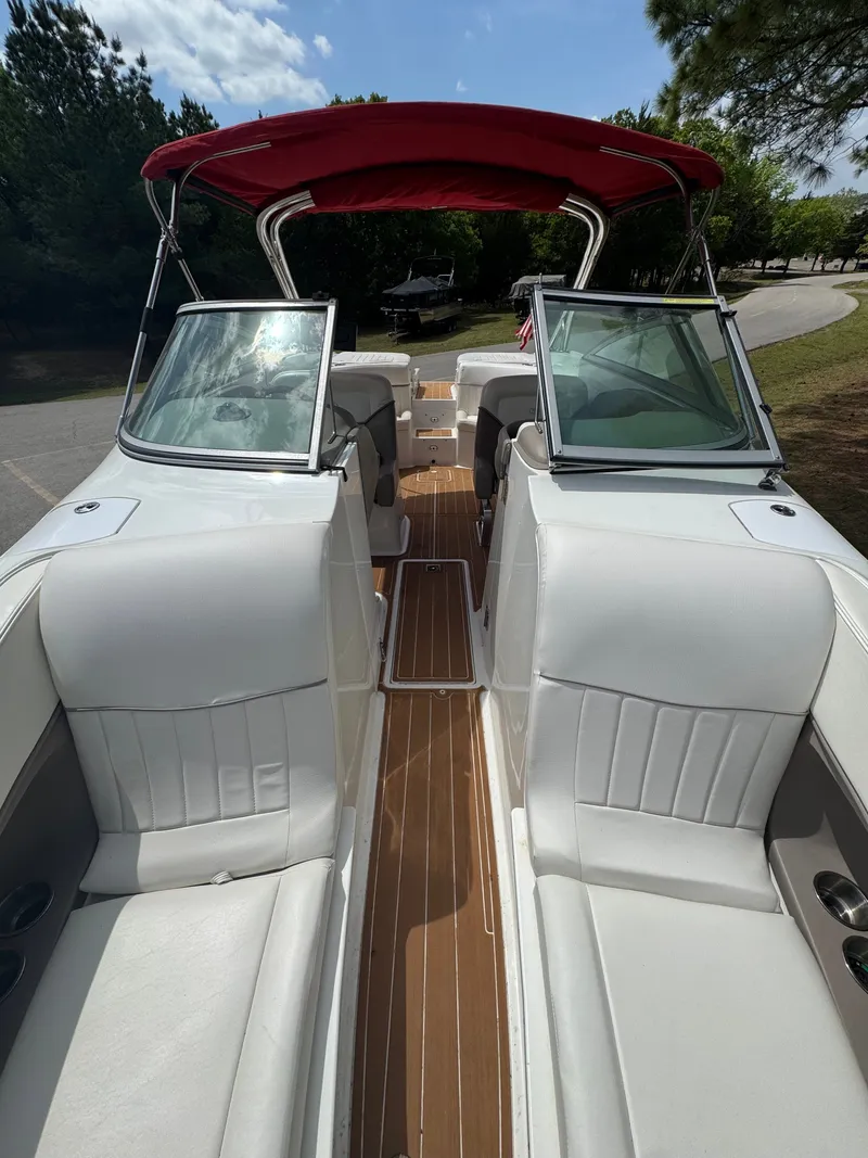 Slide: The Image of 2003 Cobalt 282 boat with red canopy and white interior. - 12