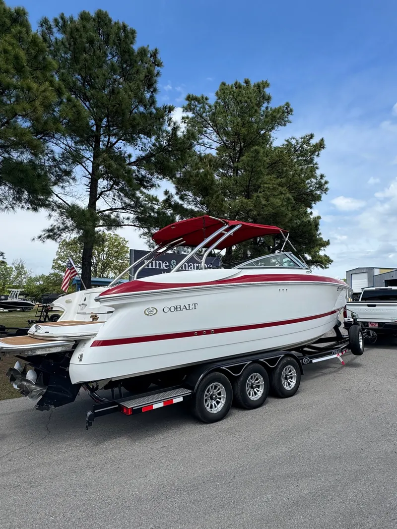 Slide: The Image of 2003 Cobalt 282 boat on trailer, white with red stripe. - 2