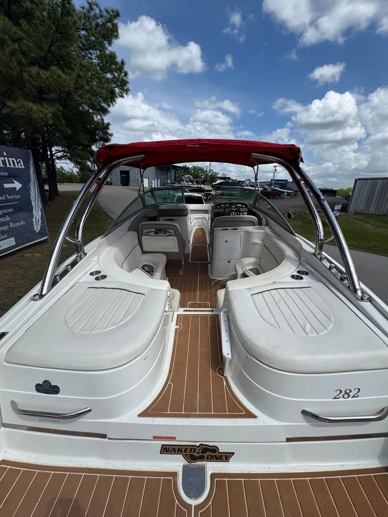 Slide: The Image of 2003 Cobalt 282 boat with red canopy and white interior. - 4