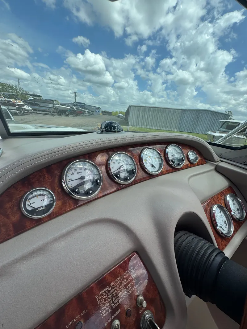 Slide: The Image of Dashboard of a 2003 Cobalt 282 boat with cloudy sky. - 6