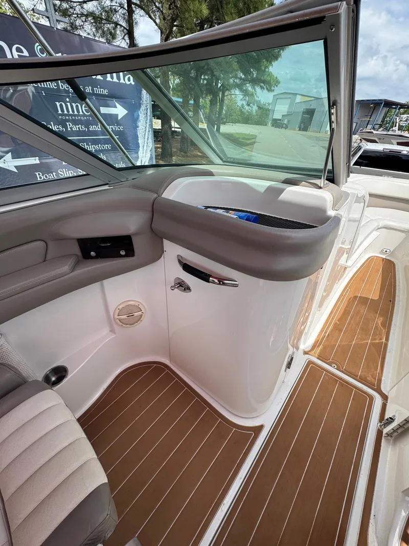 Slide: The Image of Interior of a 2003 Cobalt 282 boat with wood flooring. - 9