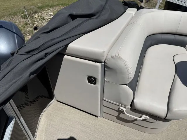 Slide: The Image of Interior of a 2017 Bennington 21SLX pontoon boat with gray upholstery. - 19