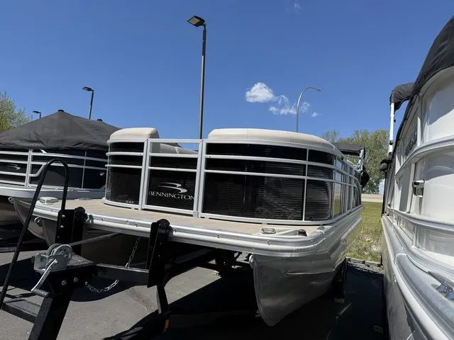 Slide: The Image of 2017 Bennington 21SLX pontoon boat on trailer, blue sky. - 2