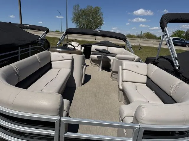 Slide: The Image of Interior view of a 2017 Bennington 21SLX pontoon boat with beige seating. - 4