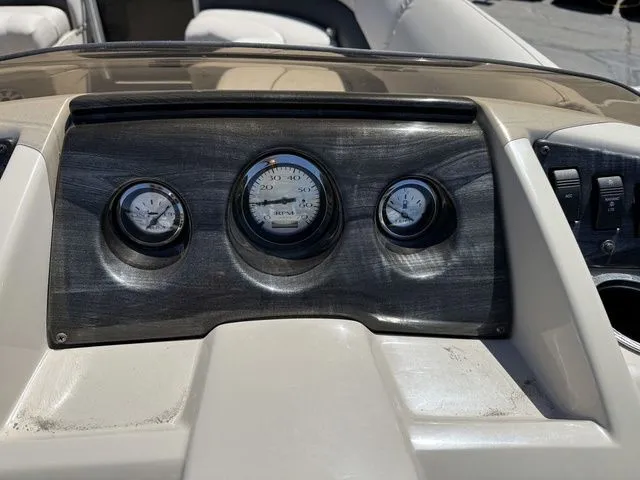 Slide: The Image of Dashboard of a 2017 Bennington 21SLX boat with three gauges. - 14