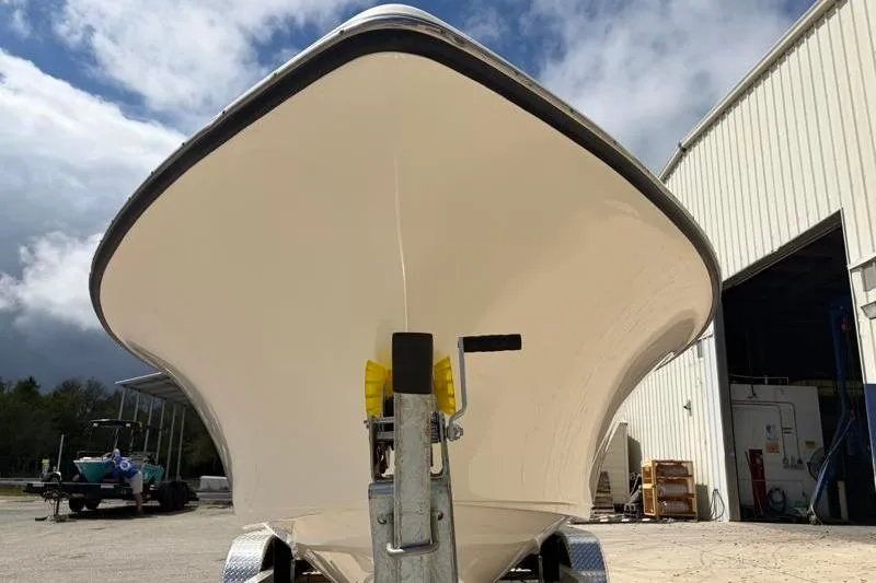 Slide: The Image of 2024 Key West 239 DFS boat on trailer under cloudy sky. - 10