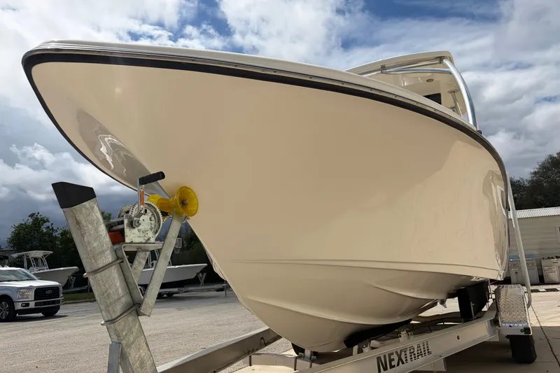 Slide: The Image of 2024 Key West 239 DFS boat with Yamaha engine and swim ladder. - 12