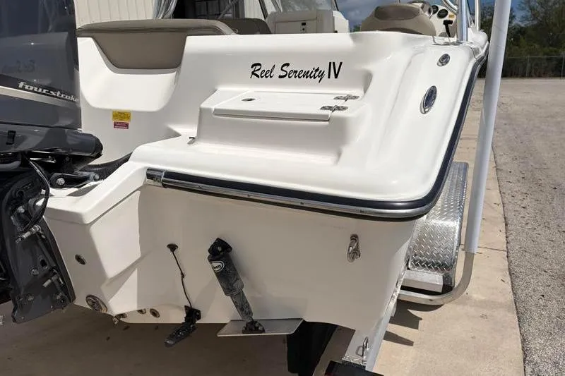 Slide: The Image of 2024 Key West 239 DFS boat with sleek design and sturdy T-top structure. - 15