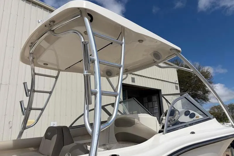 Slide: The Image of 2024 Key West 239 DFS boat interior with beige seating and cup holders. - 17