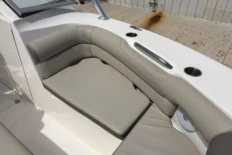 Slide: The Image of 2024 Key West 239 DFS boat dashboard with steering wheel and control panel. - 20