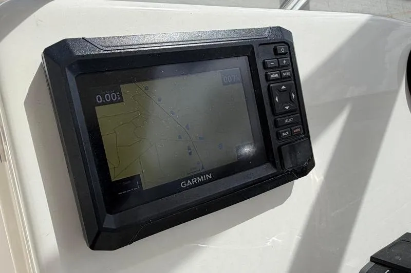 Slide: The Image of Dashboard of 2024 Key West 239 DFS boat with Yamaha gauges and safety warning. - 24