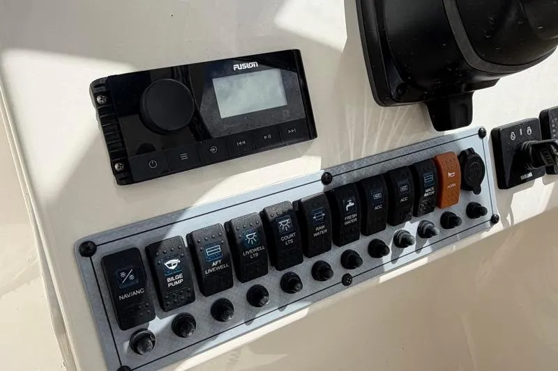 Slide: The Image of 2024 Key West 239 DFS boat controls with throttle and trim tabs. - 25
