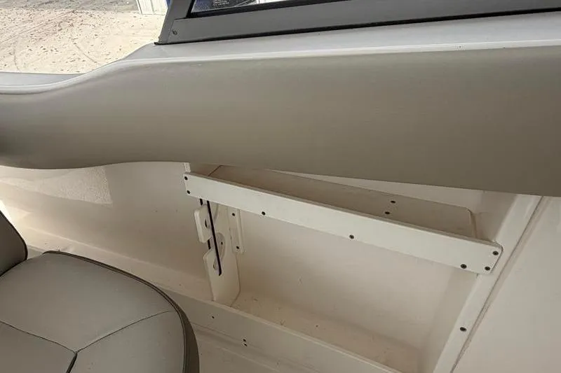 Slide: The Image of 2024 Key West 239 DFS boat interior with seating and storage area. - 29