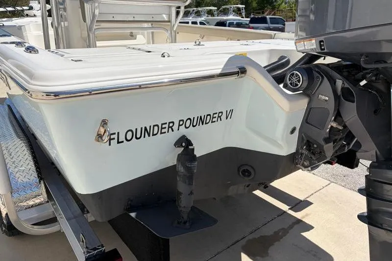 Slide: The Image of 2024 Key West 210 Bay Reef boat with "Flounder Pounder VI" name, on trailer. - 13
