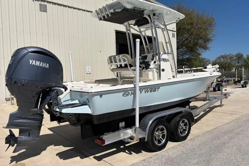Slide: The Image of 2024 Key West 210 Bay Reef boat with Yamaha engine on a trailer. - 2