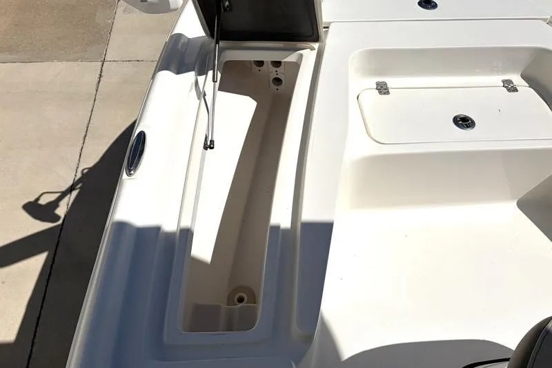 Slide: The Image of 2024 Key West 210 Bay Reef boat deck with open storage compartments. - 22